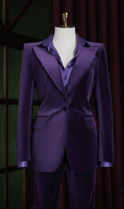 Purple suit on a mannequin against a dark background