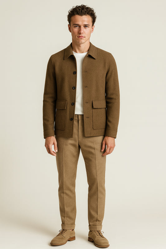 Man wearing a brown jacket and beige pants on a white background