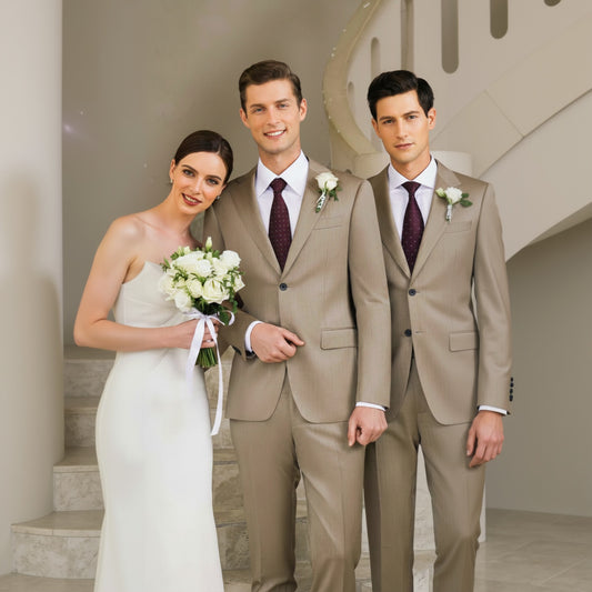 Two men in suits standing with a woman in a wedding dress on a staircase.