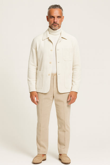 Man wearing a cream-colored suit with a white background