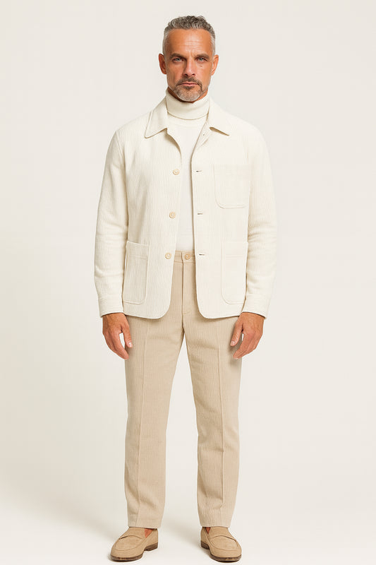 Man wearing a cream-colored suit with a white background