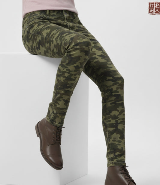 Camouflage pants worn by a person on a white background