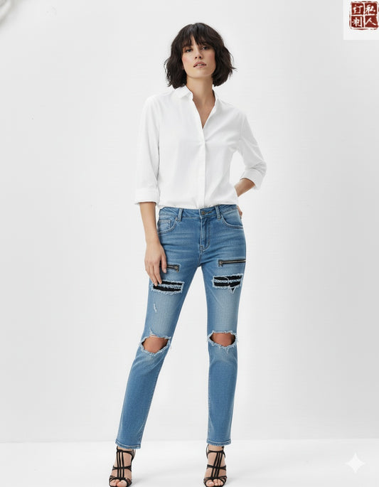 Woman wearing a white shirt and ripped blue jeans on a white background