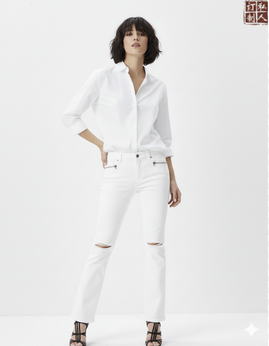 Person wearing a white shirt and white pants on a white background