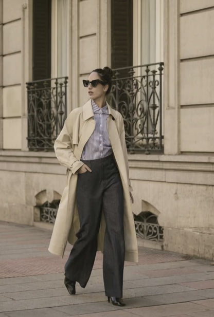 Women walking in beige raincoat 